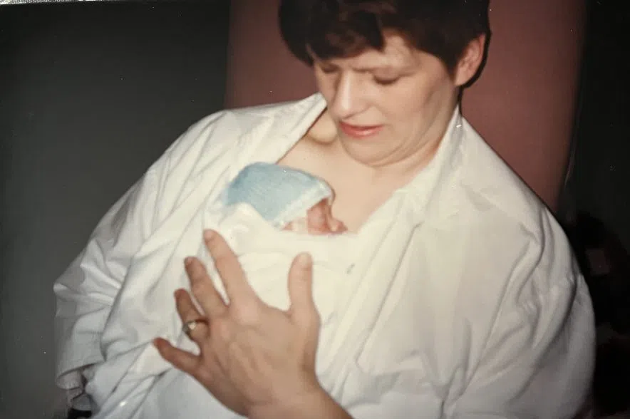 Cathy White Ferland holds Logan Ferland for the first time