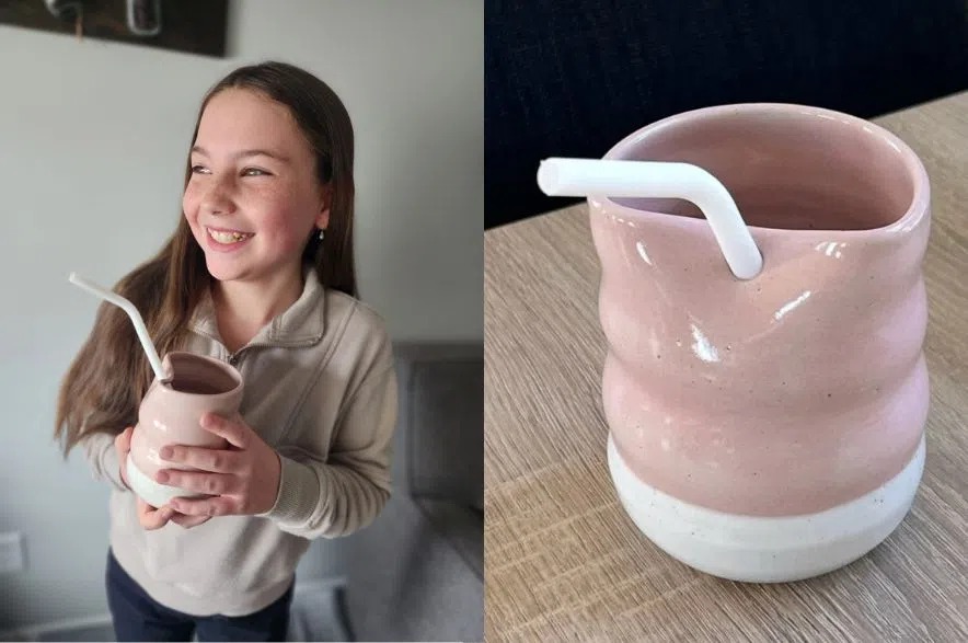Lexi holding her cup, created in collaboration with Farm Girl Pottery
