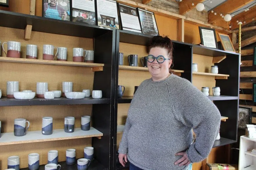 Marea Olafson standing inside Freba Pottery