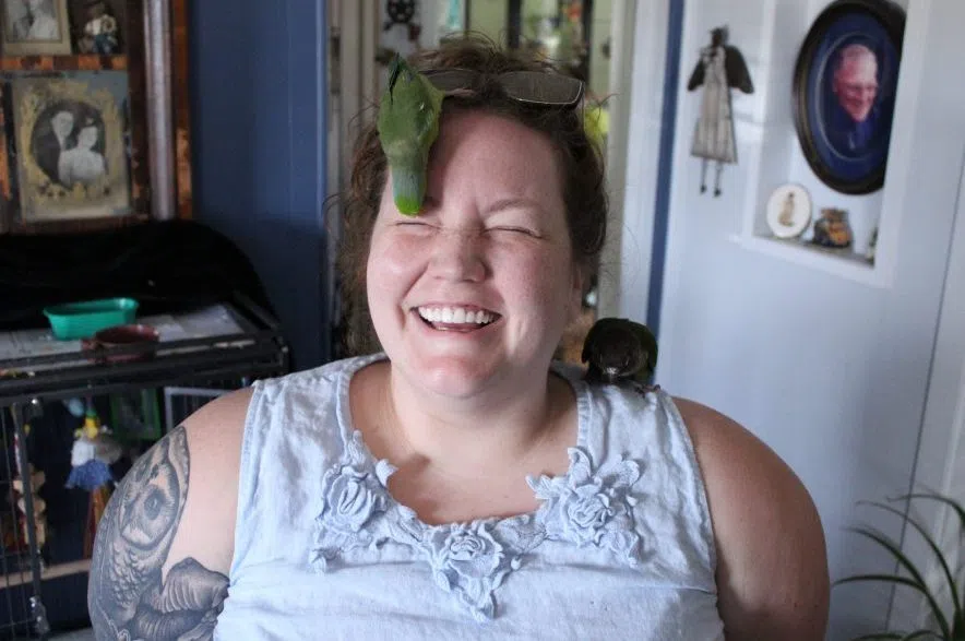 Jenny Tait with her parrotlet, Lizzie