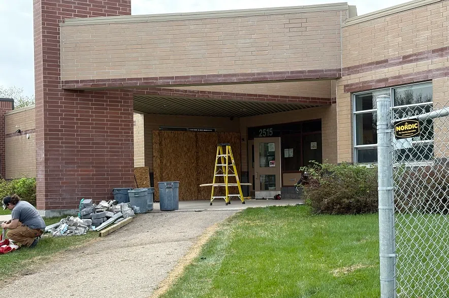 Plywood over a window near the front entrance after a vehicle rammed into it (Will Mandzuk/650CKOM)