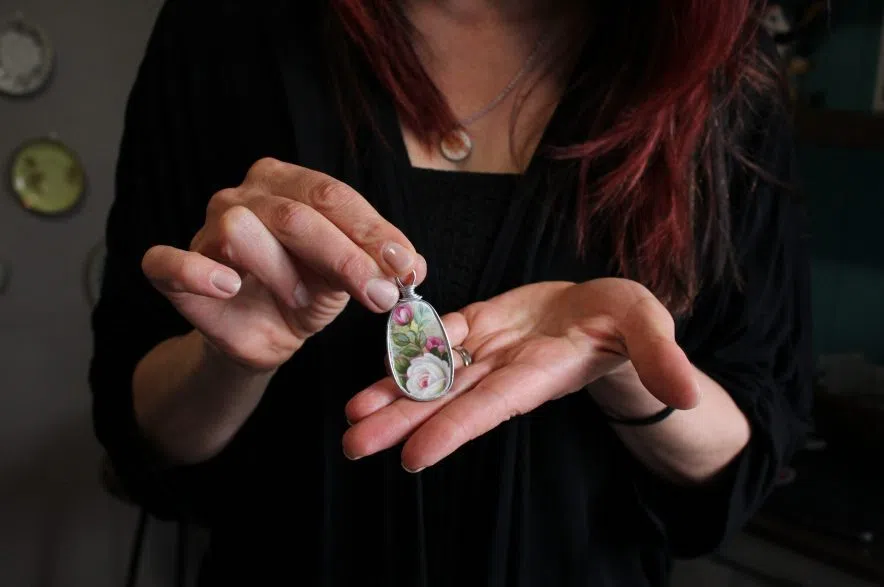 Wollf holds a pendant