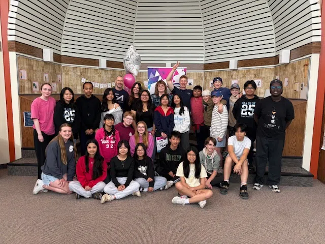 Mme. Lorianne Brown (centre) with some of her Grade 7/8 students and members of the C95 team. (C95/submitted)