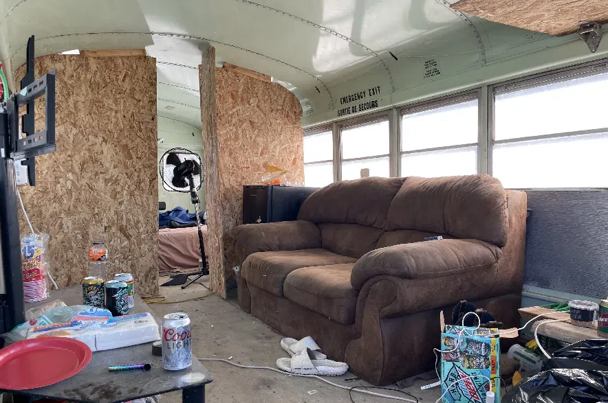 The bus, which features a couch, plywood walls and a bed at the back end also has functioning outlets, letting Bestrop keep fans going while he’s parked.