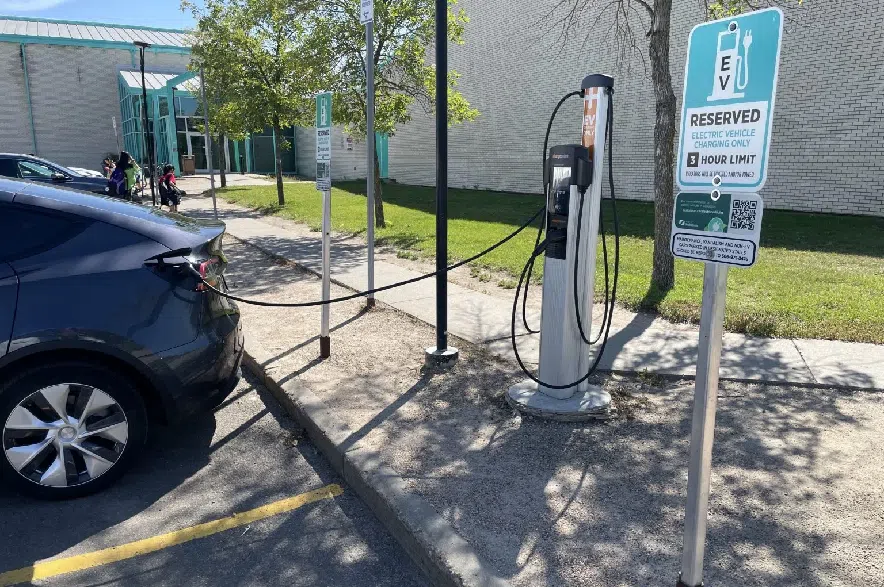 A grey Tesla is plugged in to the electric vehicle charger outside of Lakeview Civic Center