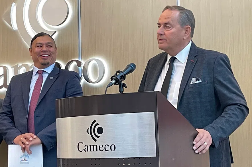 Sheldon Wuttunee, president and CEO of the Saskatchewan First Nations Natural Resource Centre of Excellence, smiles as Cameco CEO Tim Gitzel speaks during the launch of the Saskatchewan First Energy Security Strategy and Supply Plan on Oct. 20, 2025.