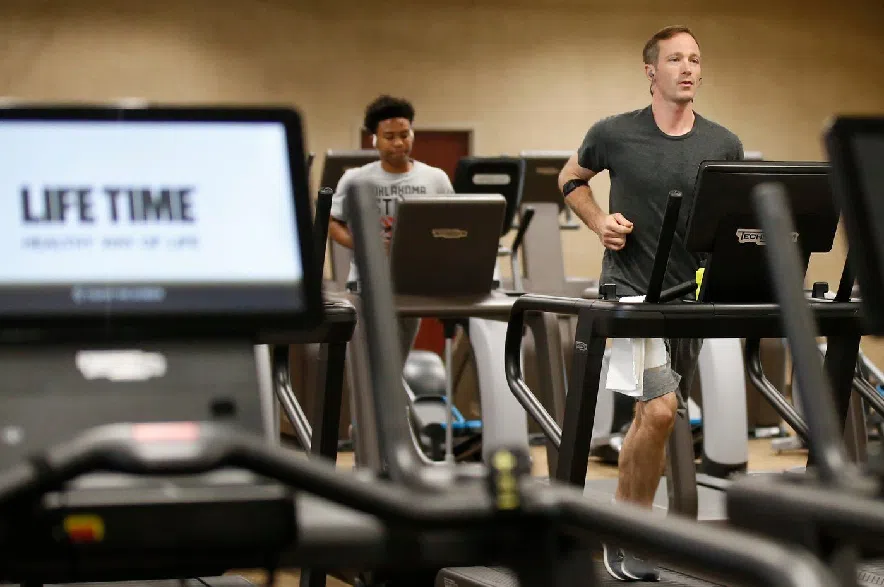 People run on treadmills at Life Time Athletic May 8, 2020, in Oklahoma City.