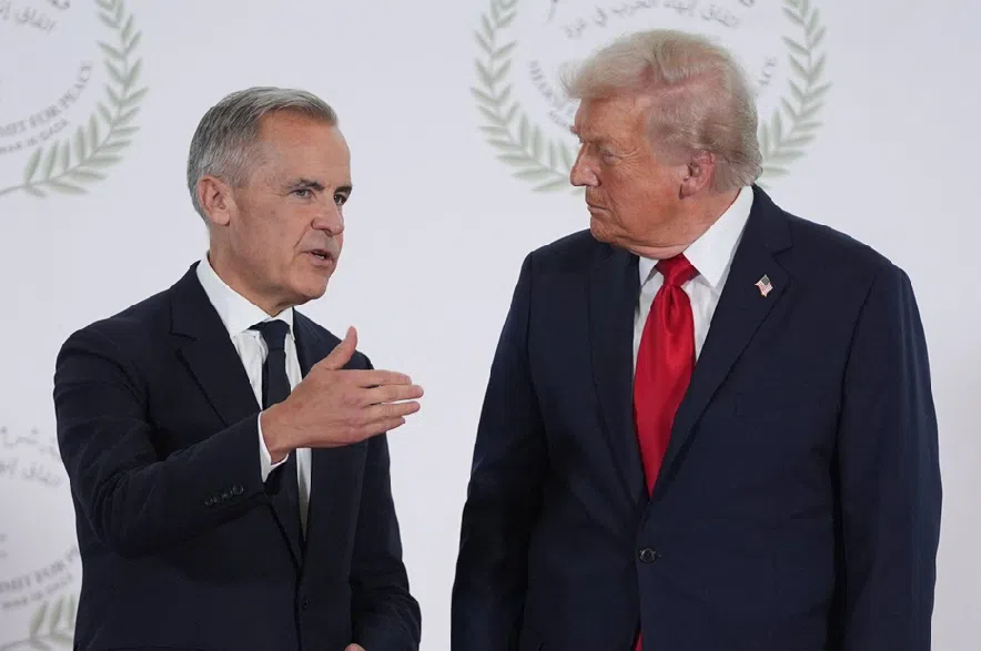 President Donald Trump greets Prime Minister Mark Carney during a summit on ending the Israel-Hamas war on Monday, Oct. 13, 2025, in Sharm El Sheikh, Egypt.
