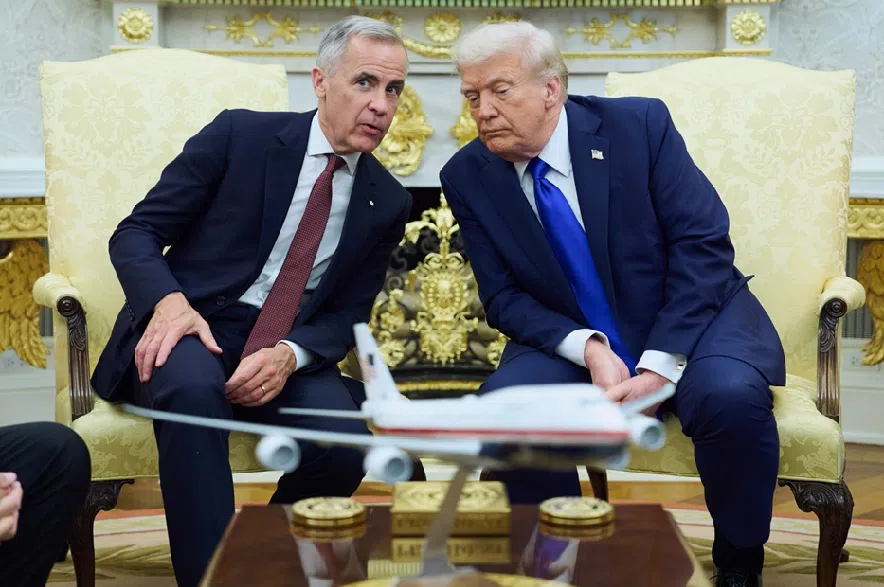 U.S. President Donald Trump meets with Canadian Prime Minister Mark Carney in the Oval Office of the White House, Tuesday, Oct. 7, 2025, in Washington.