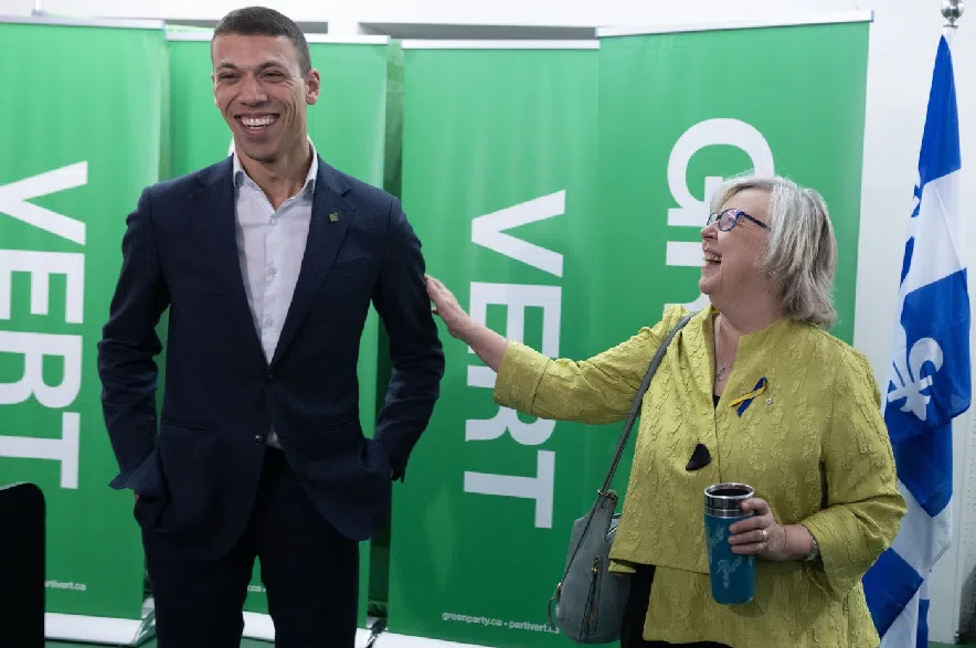Green Party of Canada leader Elizabeth May, right, and Jonathan Pedneault, then her co-leader, speak to supporters as they launch their election campaign in Montreal on Sunday, March 23, 2025.