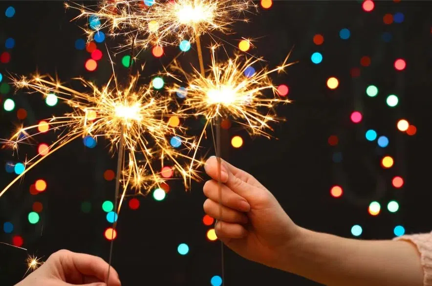 hands hold sparklers