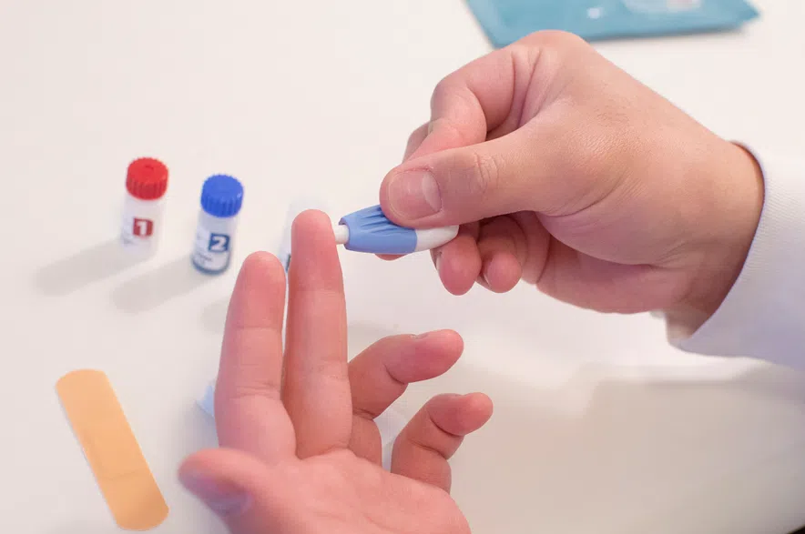 Bryan Quinones demonstrates how to use an HIV self-test kit in Toronto, on Friday, April 16, 2021.