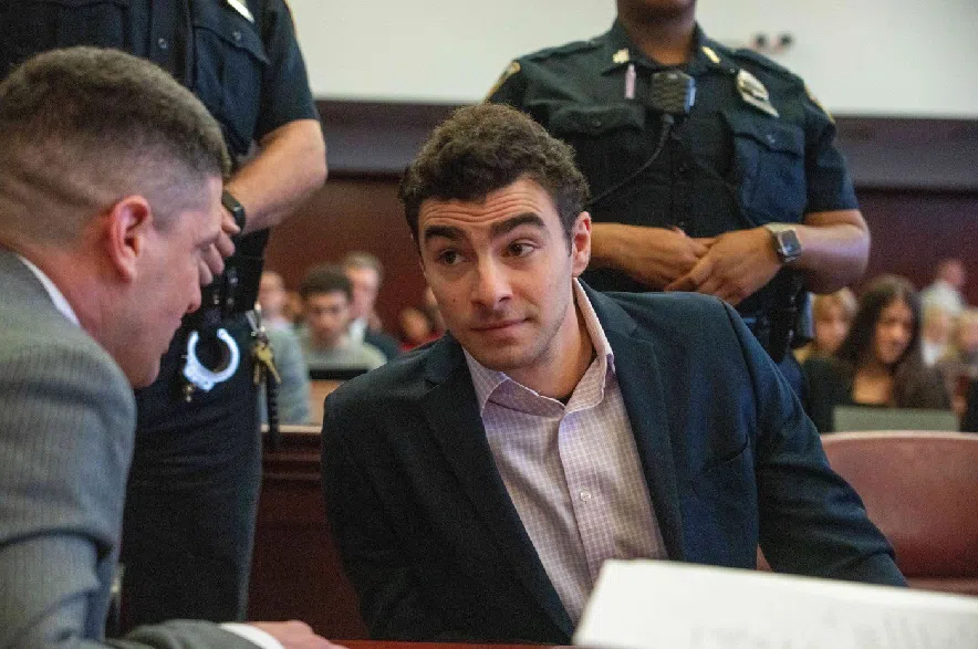 Luigi Mangione appears in Manhattan Criminal Court for an evidence hearing, Tuesday, Dec. 2, 2025, in New York.