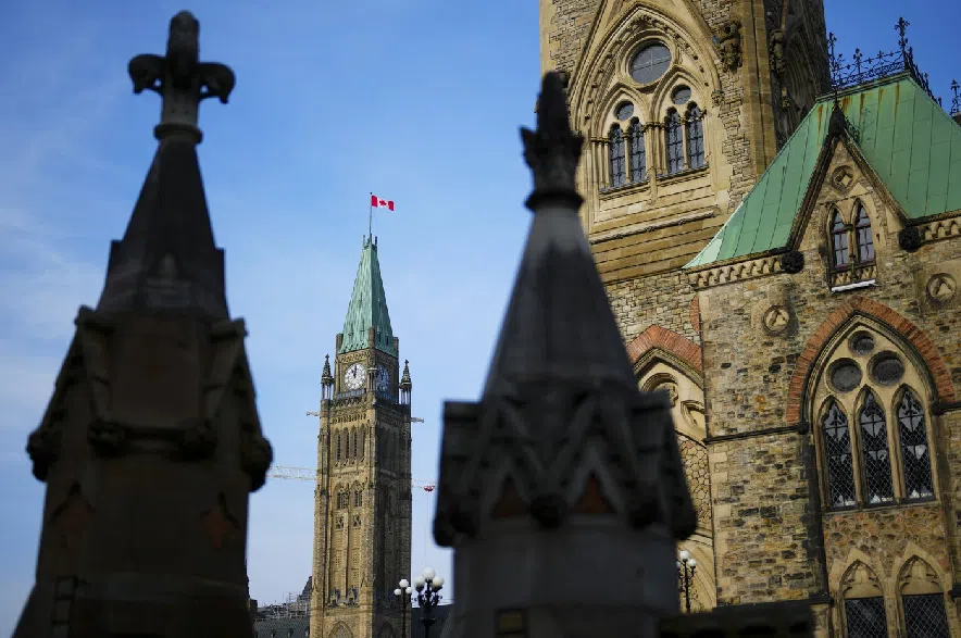 The Canadian flag flies atop the Peace Tower on Parliament Hill in Ottawa on Wednesday, Oct. 30, 2024.
