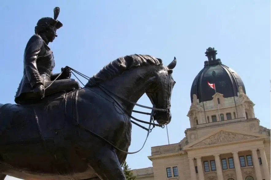 sask legislature with Queen Elizabeth II riding horse statue in foreground