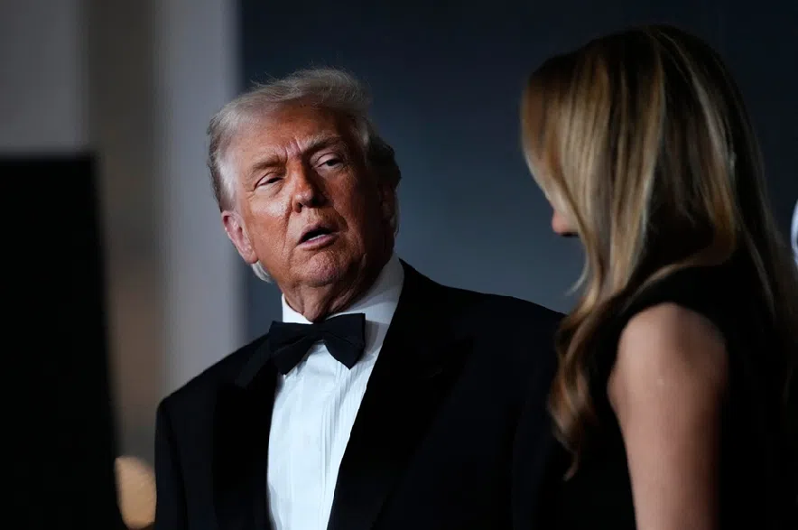 President Donald Trump and first lady Melania Trump, walk the red carpet before the 48th Kennedy Center Honors, Sunday, Dec. 7, 2025, at the John F. Kennedy Center for the Performing Arts in Washington.
