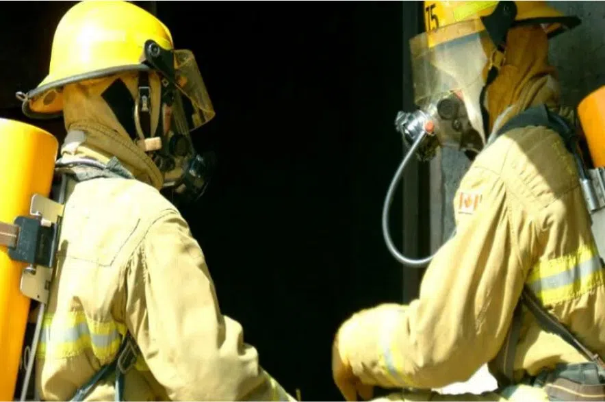 two firefighters in uniforms