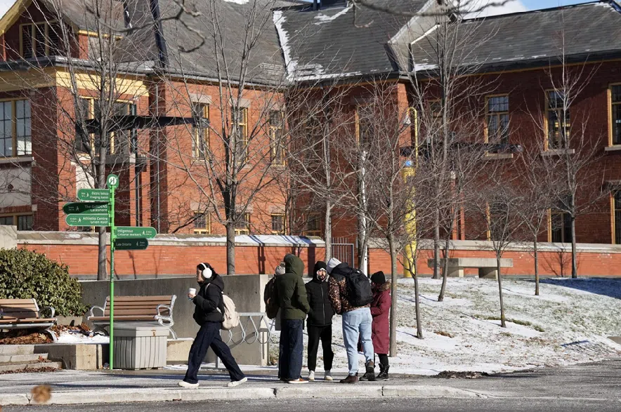 Caption: Students walk on campus at the Humber College Lakeshore Campus in Toronto on Thursday, December 11, 2025.
