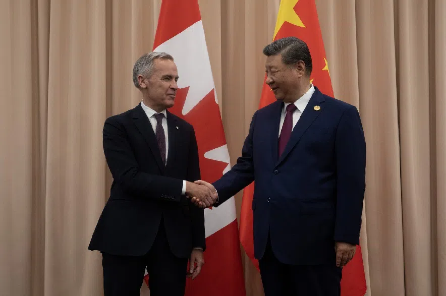 Prime Minister Mark Carney, left, shakes hands with Chinese President Xi Jinping at the start of a meeting in Gyeongju on Friday, Oct. 31, 2025.