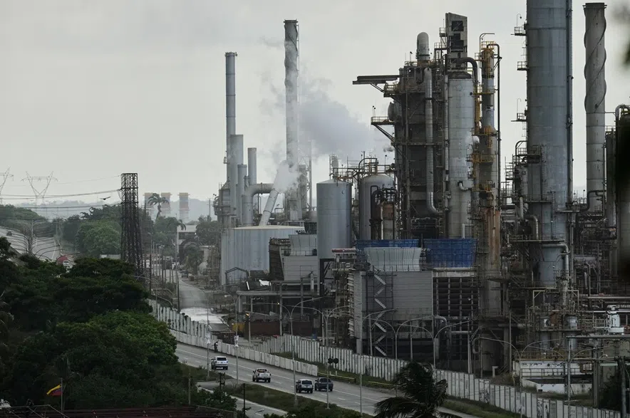 Vehicles drive past the El Palito refinery in Puerto Cabello, Venezuela, Sunday, Dec. 21, 2025.