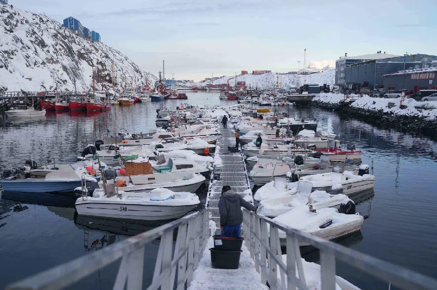 Fishermen arrive at the harbour of Nuuk, Greenland, Wednesday, Jan. 14, 2026.