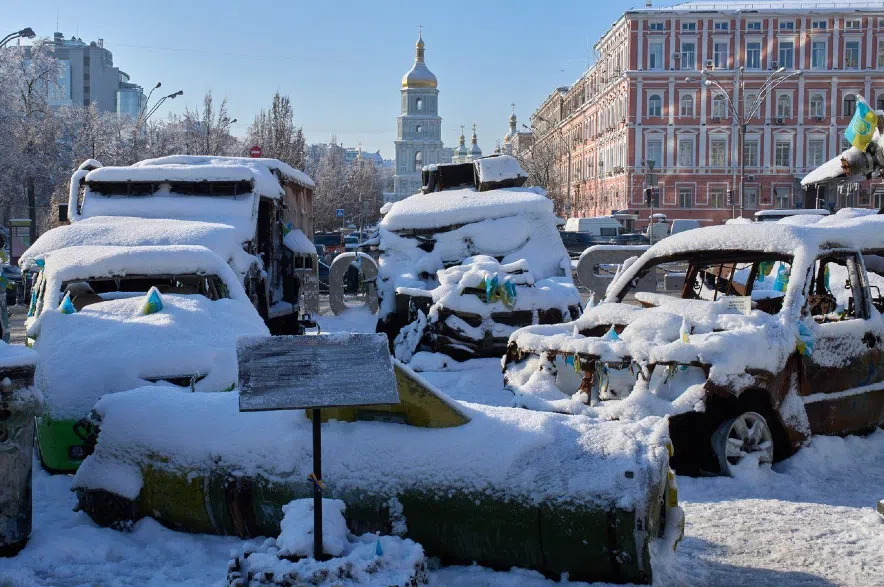 Snow covered, damaged Russian military vehicles.