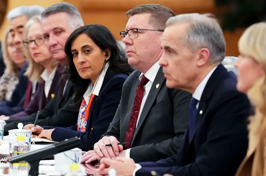 Premier of Saskatchewan Scott Moe, third from right, sits beside Canadian Prime Minister Mark Carney, second from right, as they take part in a bilateral meeting with Premier of China Li Qiang at the Great Hall of the People in Beijing, China on Thursday, Jan. 15, 2026.