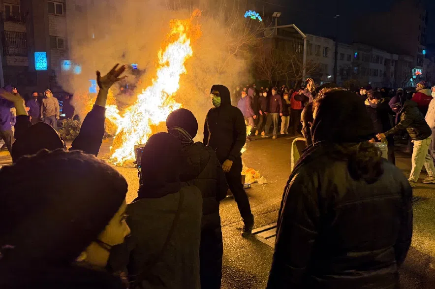 Iranians attend an anti-government protest in Tehran, Iran, Friday, Jan. 9, 2026.
