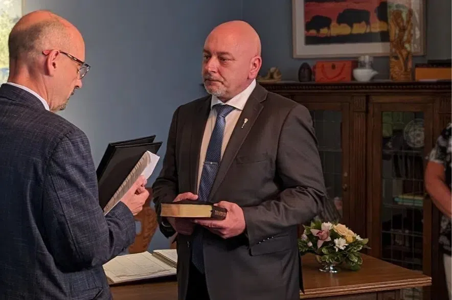 Terry Jenson being sworn into cabinet.