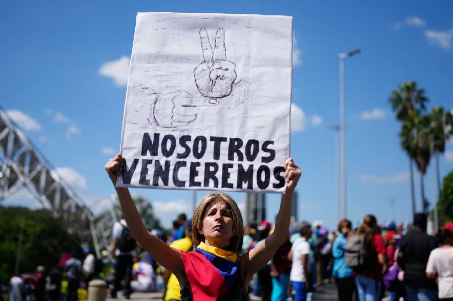 Supporters of the Venezuelan government rally calling for the release of former Venezuelan President Nicolas Maduro and his wife, who were captured by U.S. forces, in Caracas, Venezuela, Friday, Jan. 9, 2026.