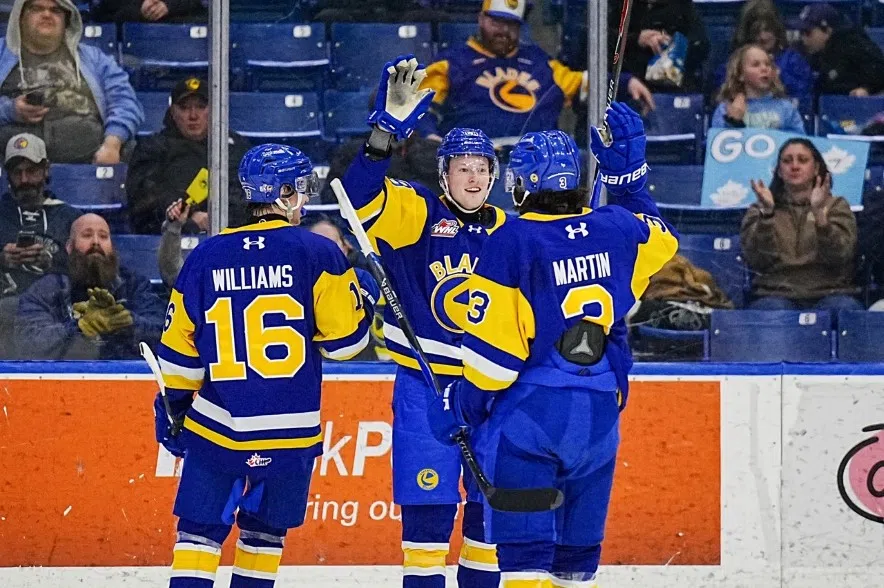 Saskatoon Blades players Cooper Williams (left), Elias Pul (centre) and Jordan Martin (right) celebrating a goal in a 5-3 victory over the Penticton Vees to clinch playoffs on Feb. 25, 2026.