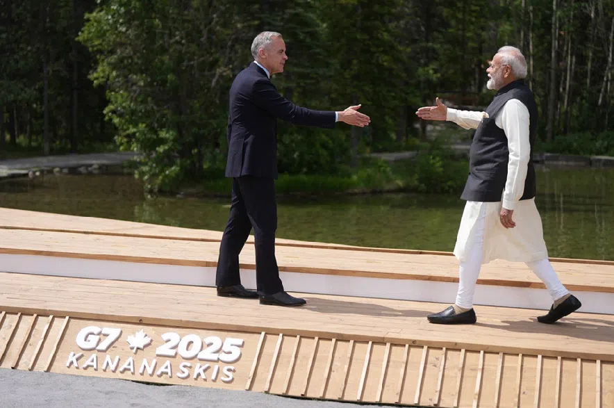 Prime Minister Mark Carney welcomes Indian Prime Minister Narendra Modi to the G7 Summit in Kananaskis, Alta., on Tuesday, June 17, 2025.