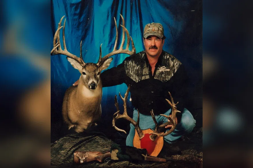 Milo Hanson with largest typical whitetail deer in November 1993.
