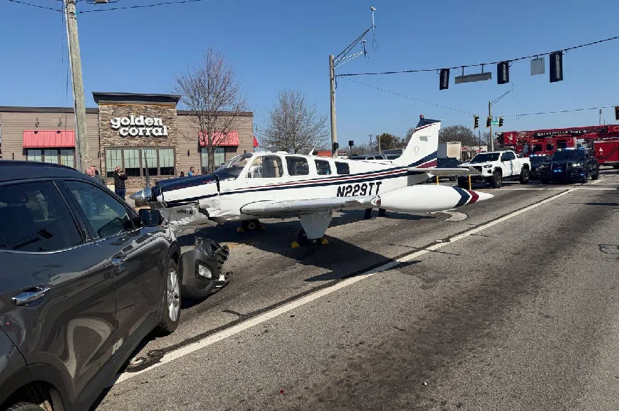 This image provided by Gainesville Police Department shows a small plane that made an emergency landing on a street in Gainesville, Ga., Monday, Feb. 9, 2026.