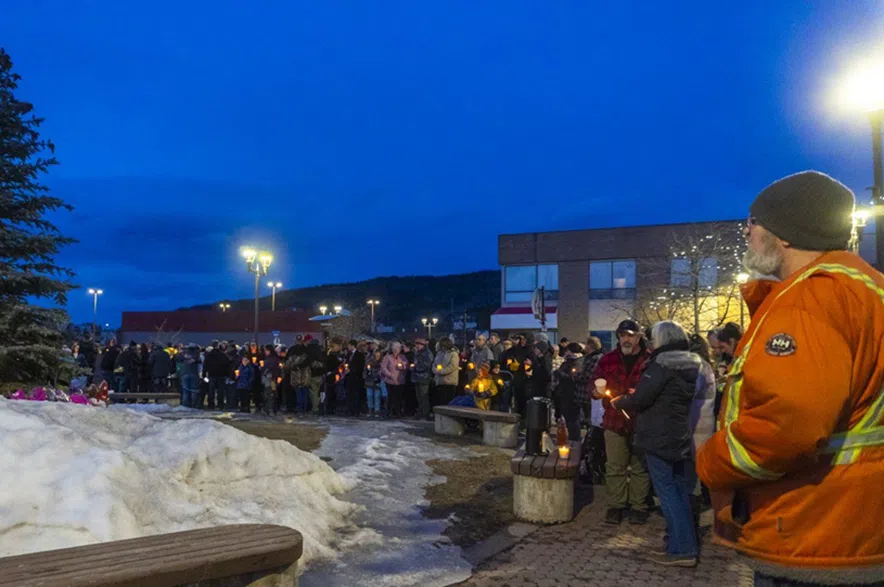 People attend a vigil to honour the victims of a mass shooting in Tumbler Ridge, B.C. on Wednesday, Feb. 11, 2026.