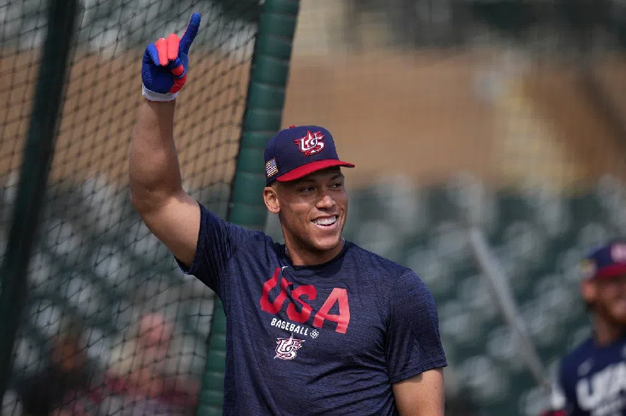 United States' Aaron Judge smiles while taking batting practice prior to an exhibition baseball game against the Colorado Rockies Wednesday, March 4, 2026, in Scottsdale, Ariz.