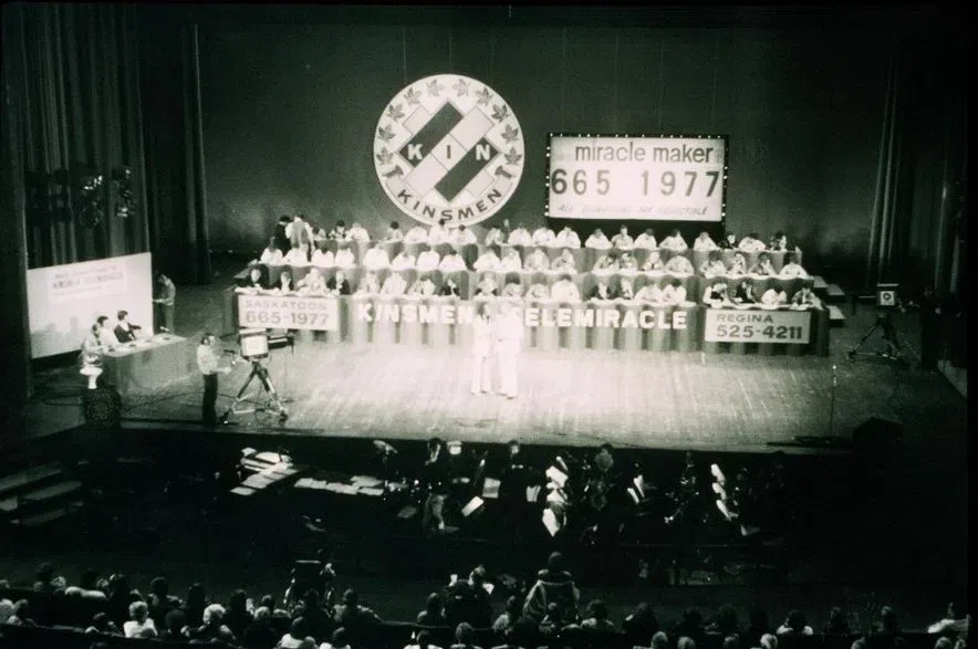 The first Telemiracle event, seen in a black and white photo still.