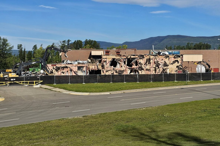 Crews operate heavy machinery as work gets underway to demolish Tumbler Ridge Secondary School in northern B.C., in an undated handout photo. The school was the site of a deadly shooting earlier this year.