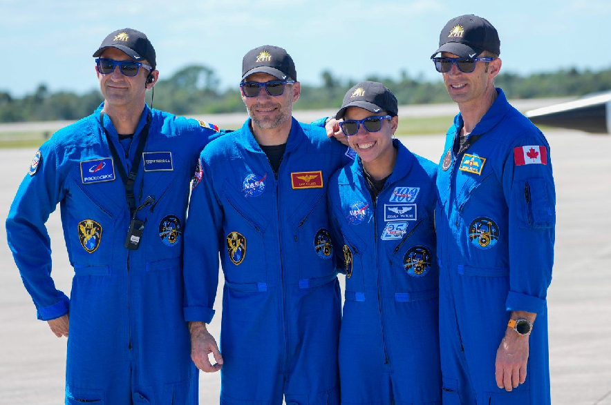 The crew for the upcoming NASA SpaceX launch (from left) — Sergey Teteryatnikov of Russia, pilot Luke Delaney, commander Jessica Watkins and Joshua Kutryk of Canada — pose for a photo at a news conference at the Kennedy Space Center in Cape Canaveral, Fla., on Saturday, Sept. 26, 2026.