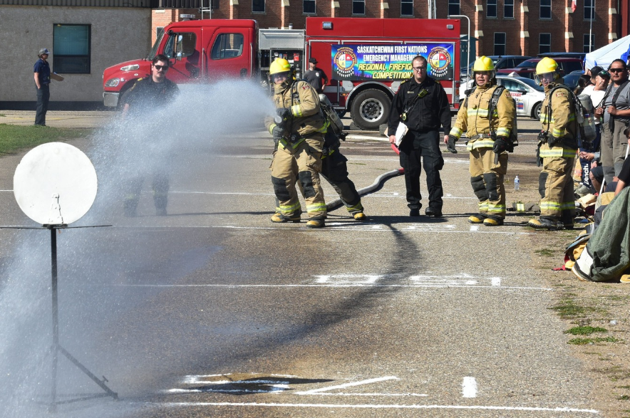 Firefighters from Cumberland House Cree Nation attempt to knock down a target during the final event of the 2026 Saskatchewan First Nation Firefighting Competition at the Prince Albert Exhibition Grounds on Sept. 19, 2026.