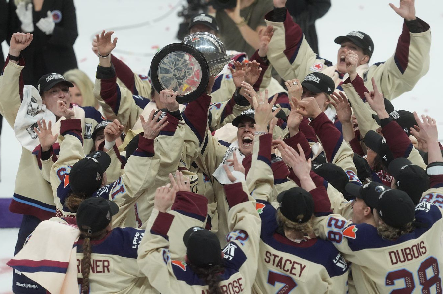 Montreal Victoire players celebrate after defeating the Ottawa Charge to win the PWHL championship in Ottawa on May 20, 2026.