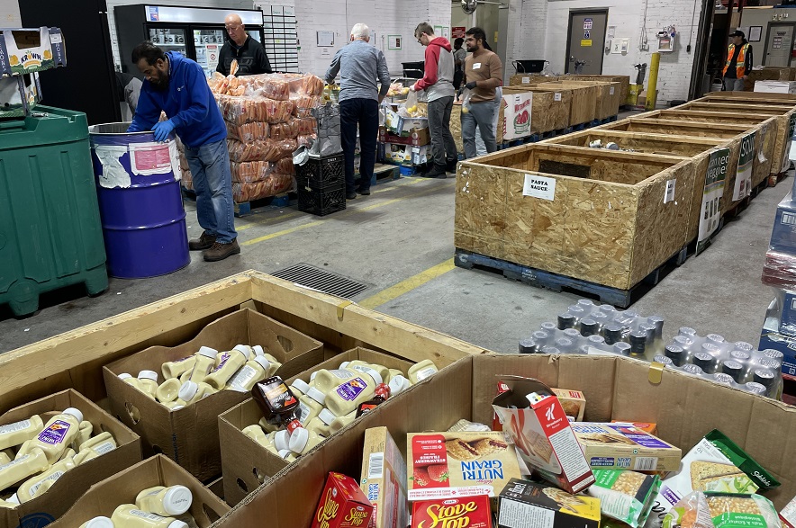 Workers sort donated items at the Saskatoon Food Bank & Learning Centre.
