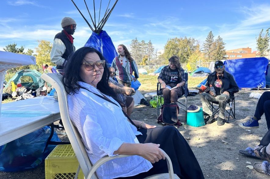 Saskatoon lawyer Crystal Fafard meets with people at the encampment on Sept. 25, 2026. (Libby Gray/650 CKOM)