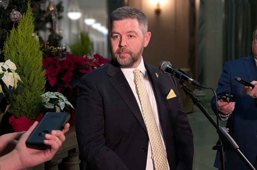 Jeremy Harrison speaking to reporters at the Saskatchewan Legislative Assembly in Regina.