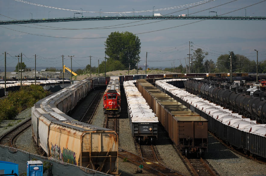 Rail cars and a locomotive are seen at CN Rail's McLean Yard near the Lions Gate Bridge, in North Vancouver, B.C., on Tuesday, Sept. 1, 2026.