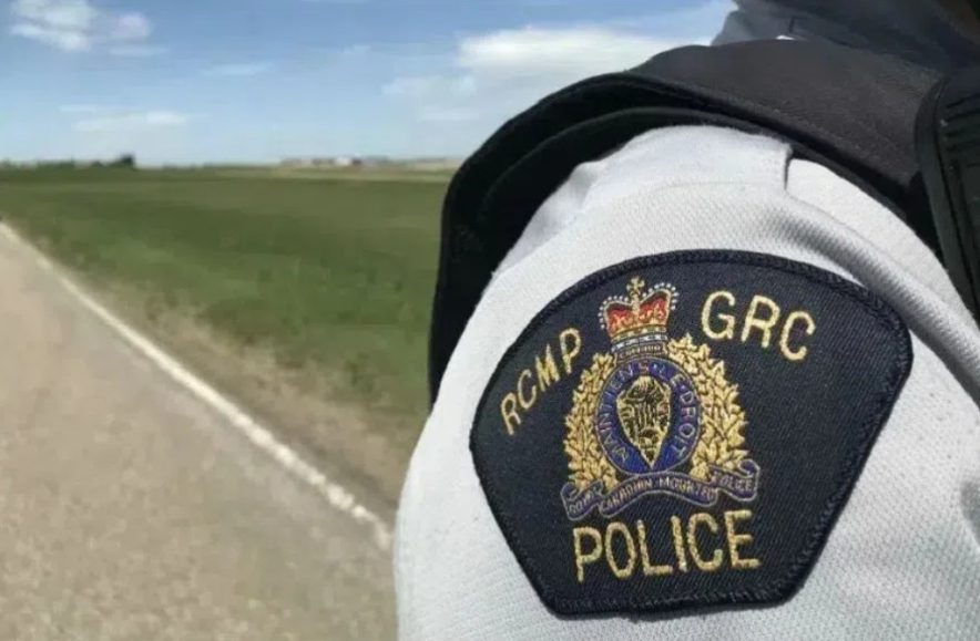 An RCMP patch on a white shirt.