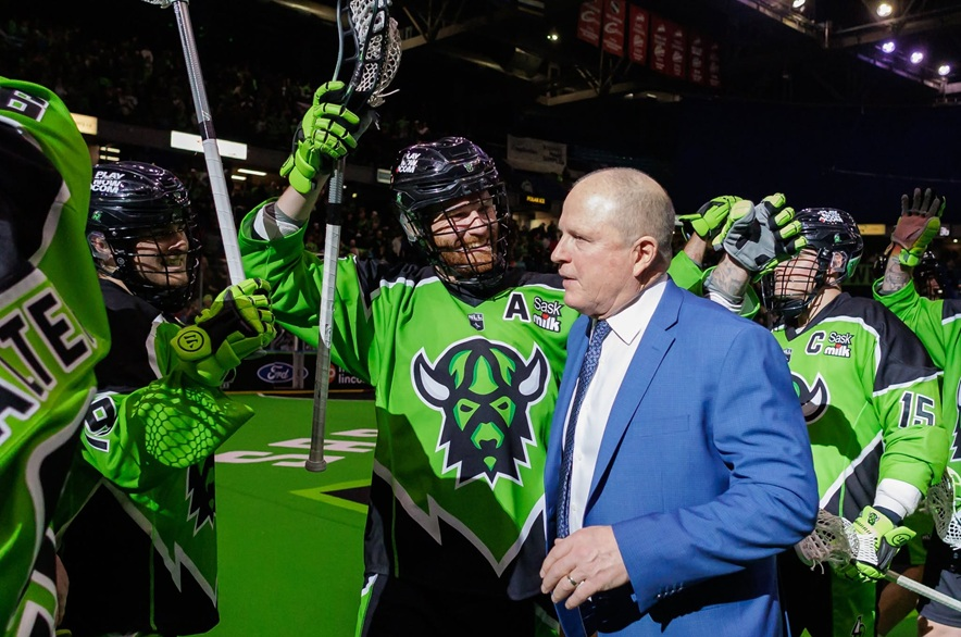 Saskatchewan Rush co-head coach and general manager Derek Keenan (right) embracing former defender Holden Garlent following a 10-9 victory over the Toronto Rock on April 18, 2026.