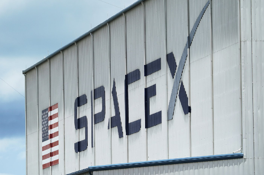 The SpaceX logo is displayed on a building, Tuesday, May 26, 2020, at the Kennedy Space Center in Cape Canaveral, Fla.