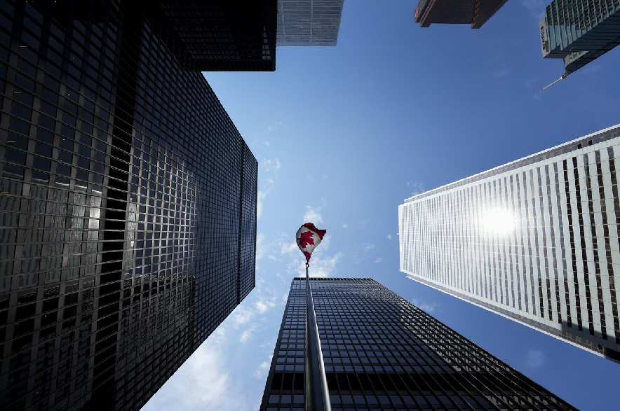 The Bay Street Financial District is shown with the Canadian flag in Toronto on Friday, Aug. 5, 2022.