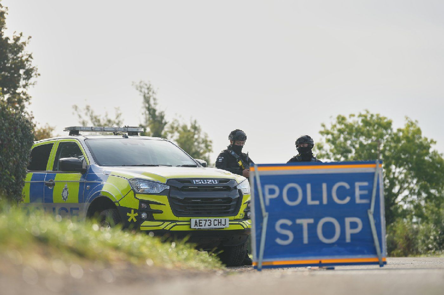Police guard a road leading to RAF Fairford, in Fairford, England, Monday, Sept. 28, 2026.